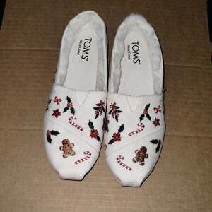 TOMS Women's Vanilla Save The Children Santa Trains Alpargata Slip-On Flats